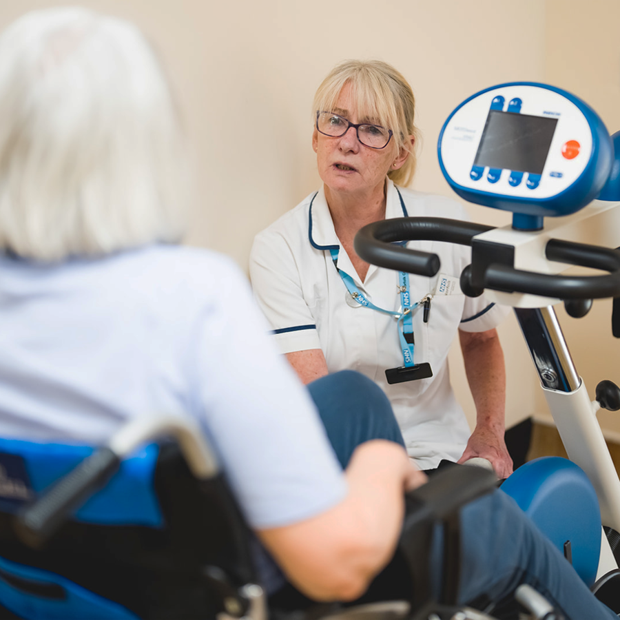 Clinician Helping Patient In A Wheelchair At Priscilla Bacon Lodge