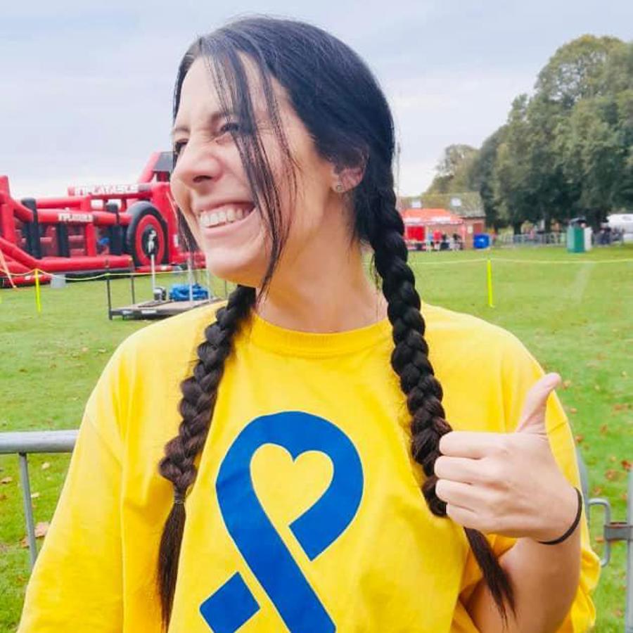 Woman Smiling Thumbs Up For Nchc Charitable Fund