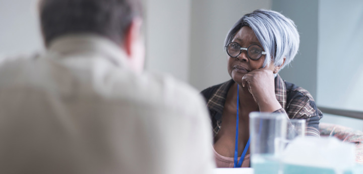 Nhs Worker Talking To Adult Man (1)