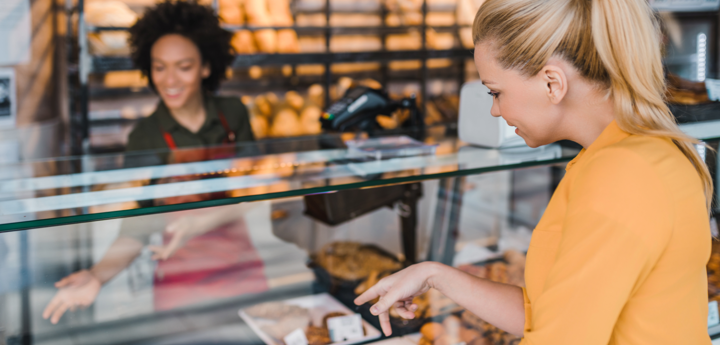 Woman buying bread in a bakery