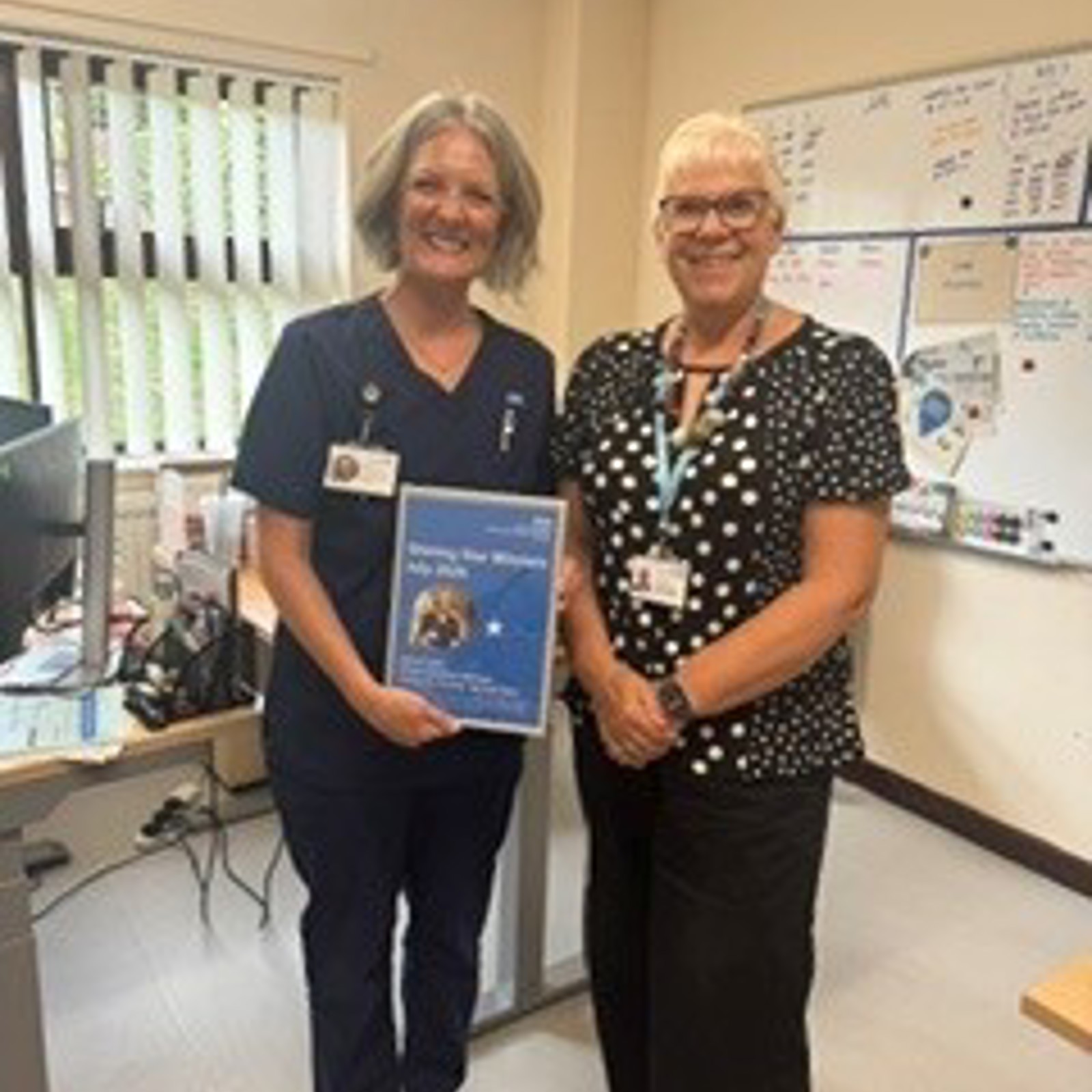 Jo Taylor holding Shining Star award