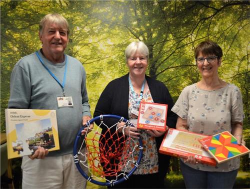 NCHC Charity donations including a puzzle, a basketball hoop and board games.