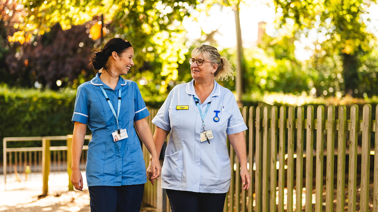 2 Nurses walking and laughing outside