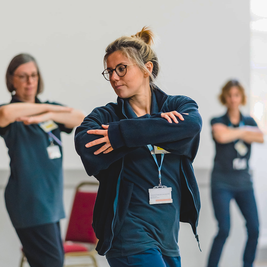 3 Clinicans Demonstrating A Stretch