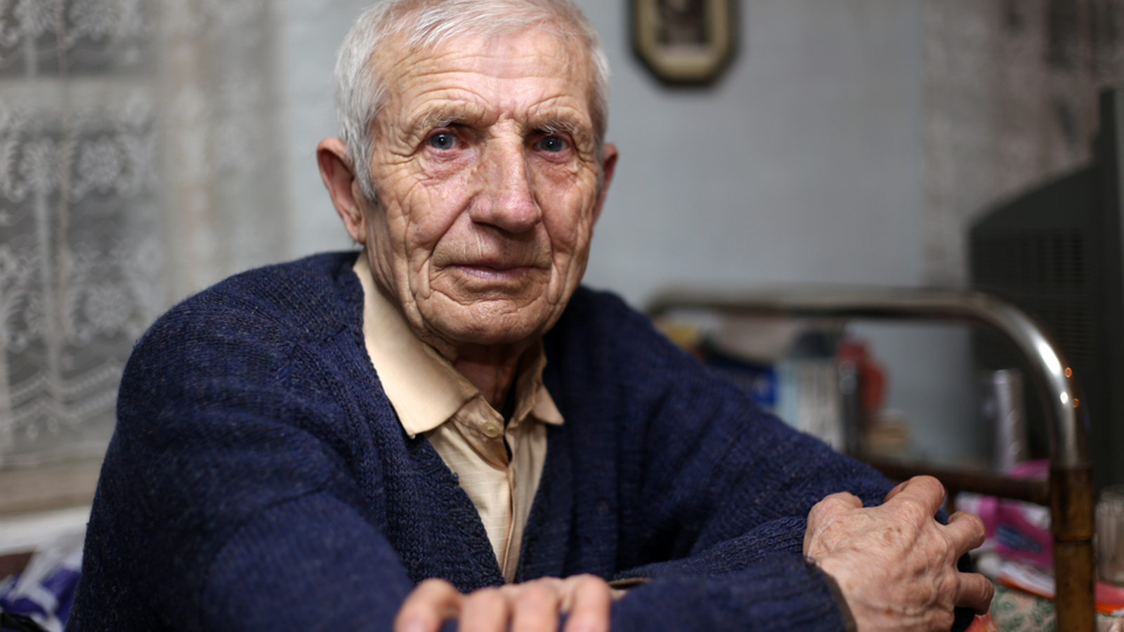Elderly man looking into the camera