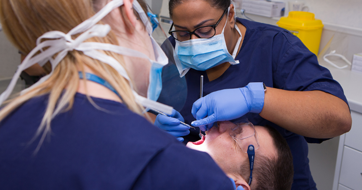 Dentists working on a patient