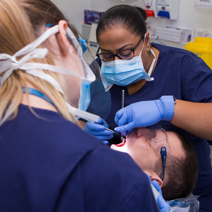 Dentists working on a patient