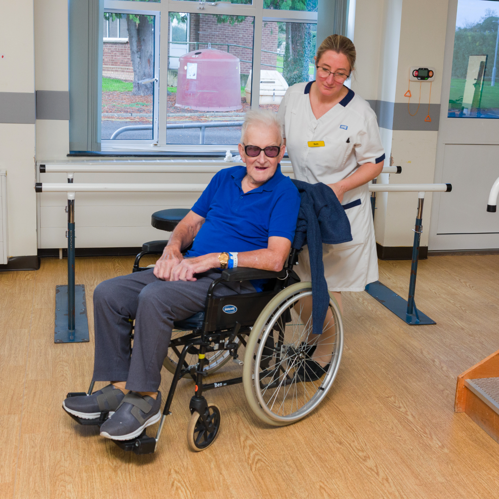 Nurse with a patient in a wheelchair