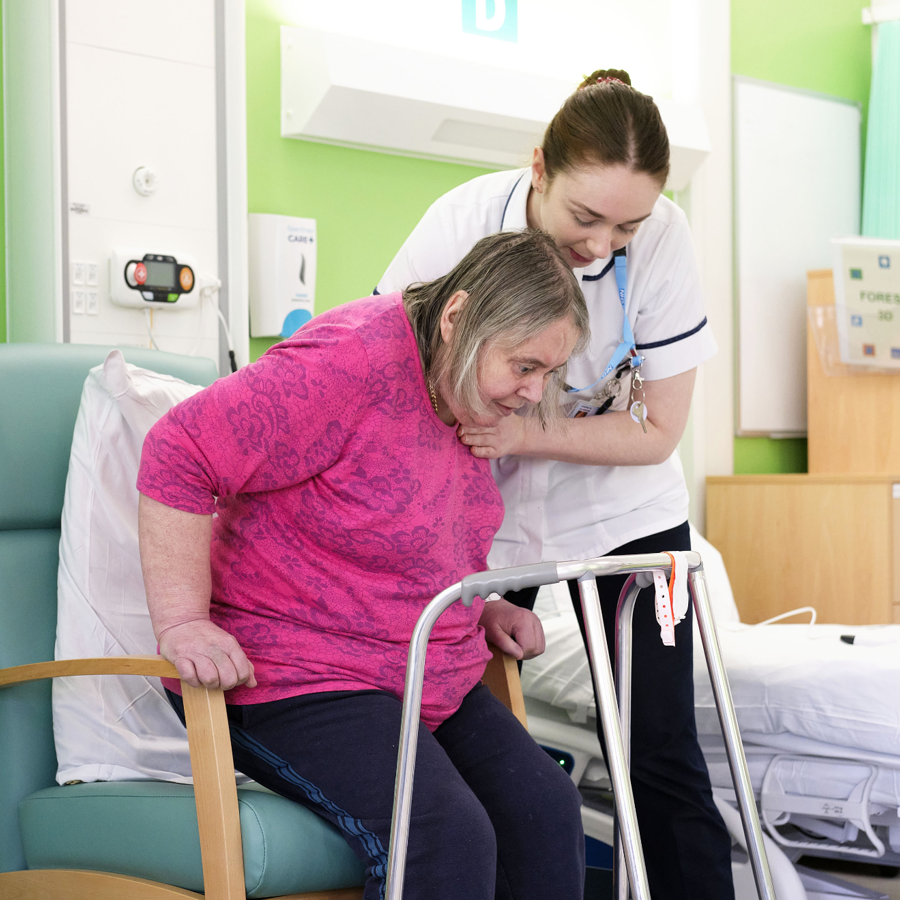 Willow Therapy Staff Member Supporting Patient To Stand