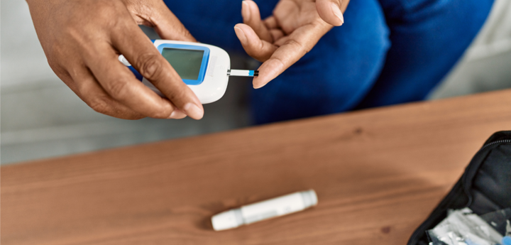 Person doing a diabetes fingertip test.