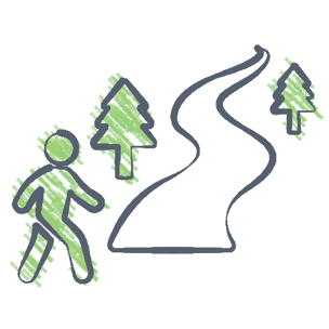 person walking pathway with trees
