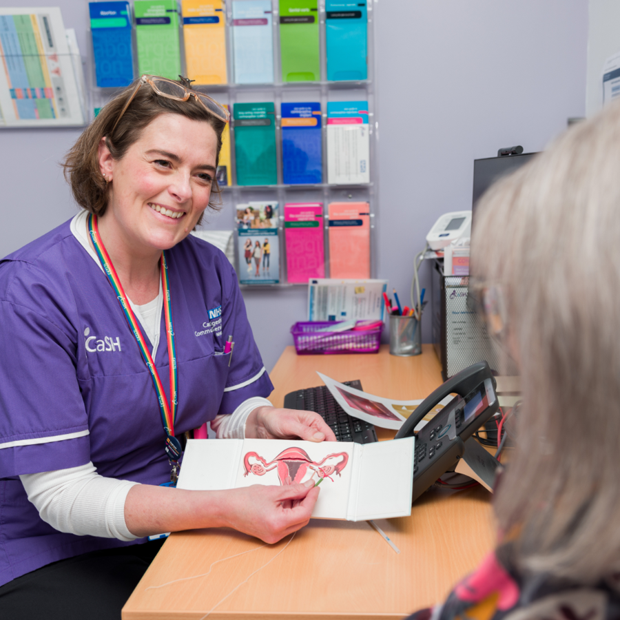 iCaSH nurse speaking to service user and smiling